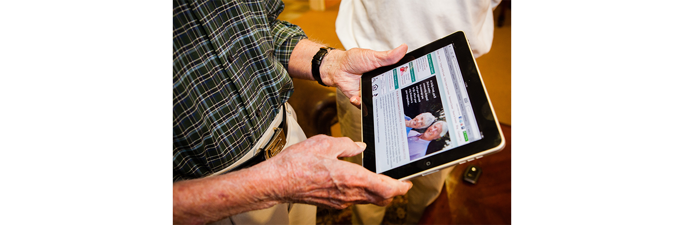 elderly man using a tablet