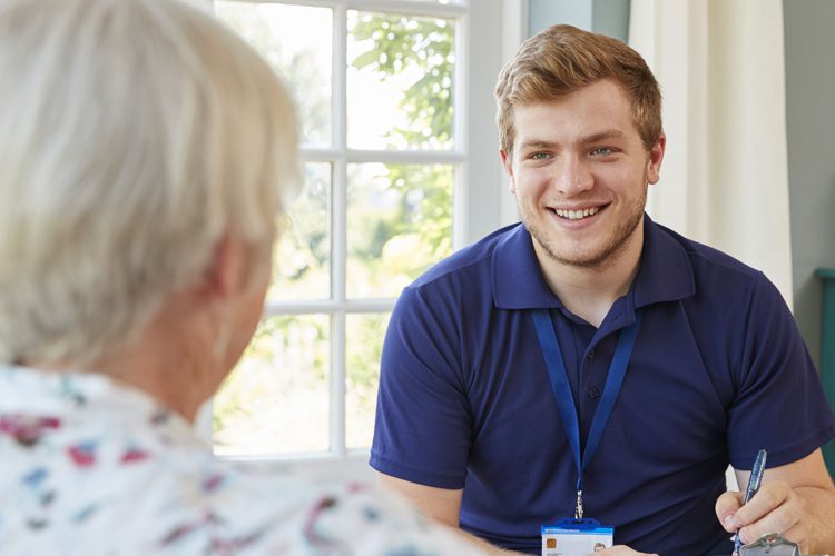 Someren Glen Senior Living Community in Centennial, CO - senior woman with young male caregiver