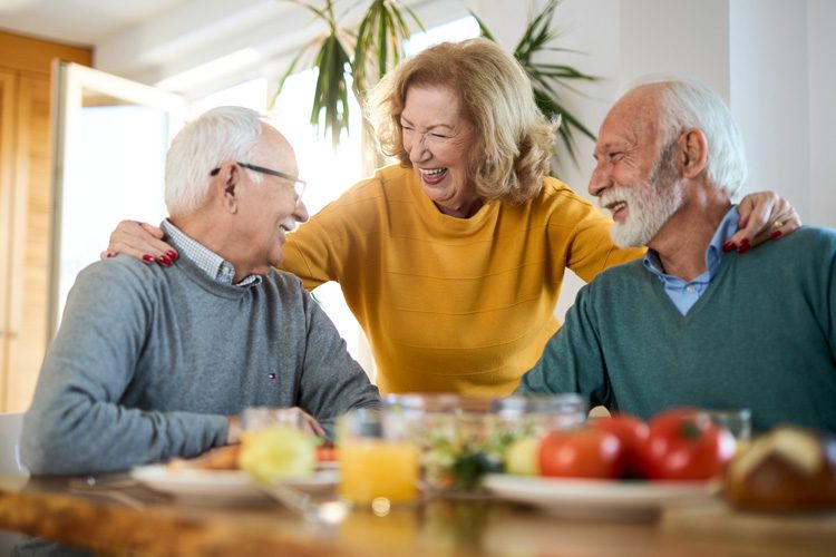 Someren Glen Senior Living Community in Centennial, CO - sg senior group eating and laughing