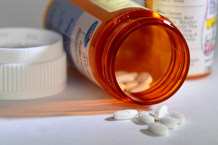 open medicine bottle with pills Someren Glen Senior Living Community in Centennial, CO - open medicine bottle with pills