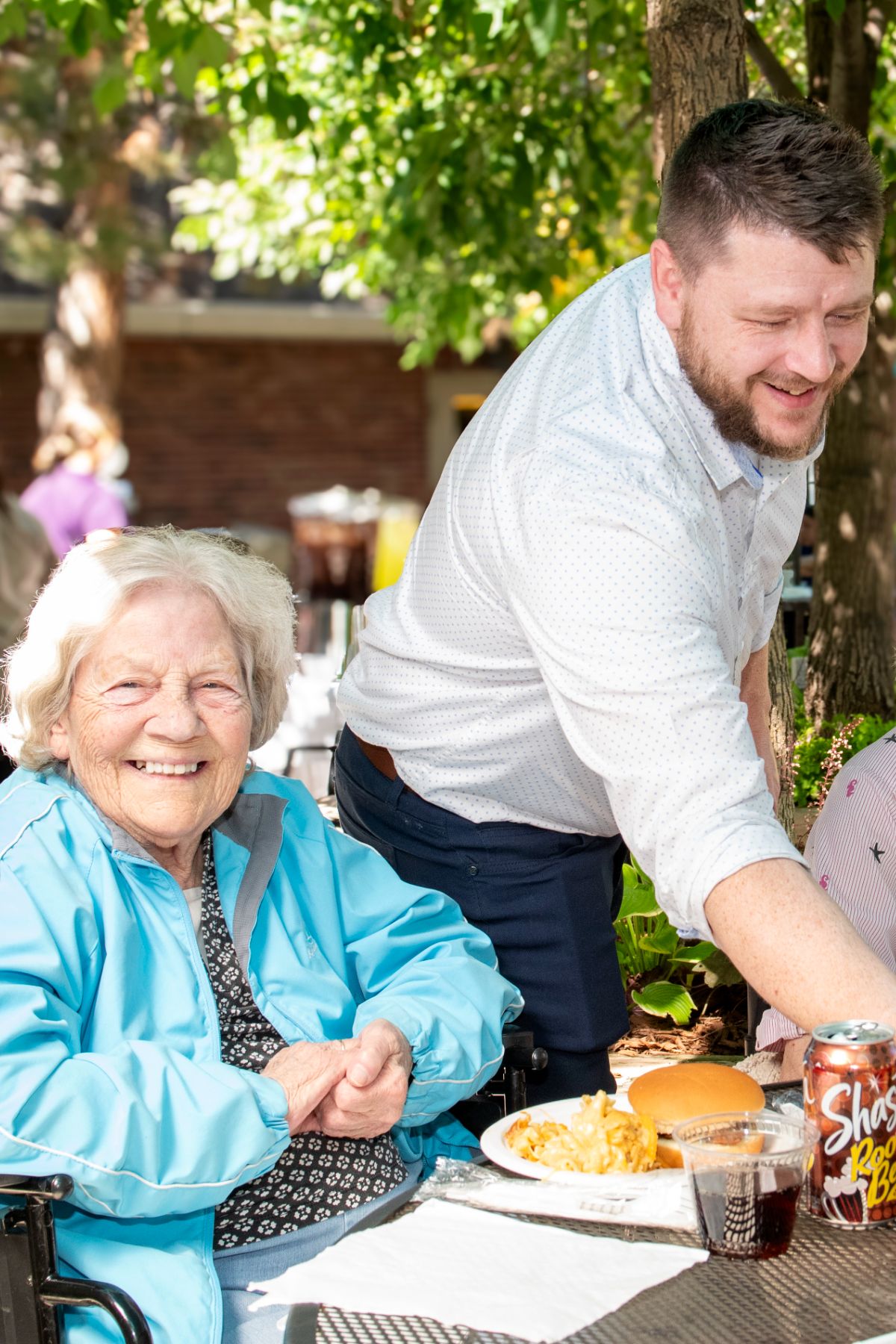 Someren Glen Senior Living Community in Centennial, CO - chef bringing watermelon to residents portrait