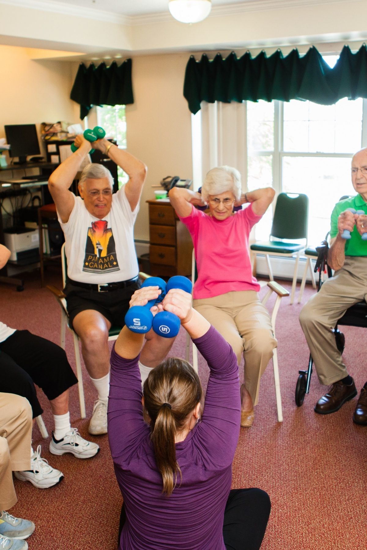 Someren Glen Senior Living Community in Centennial, CO - residents exercising with weights portrait