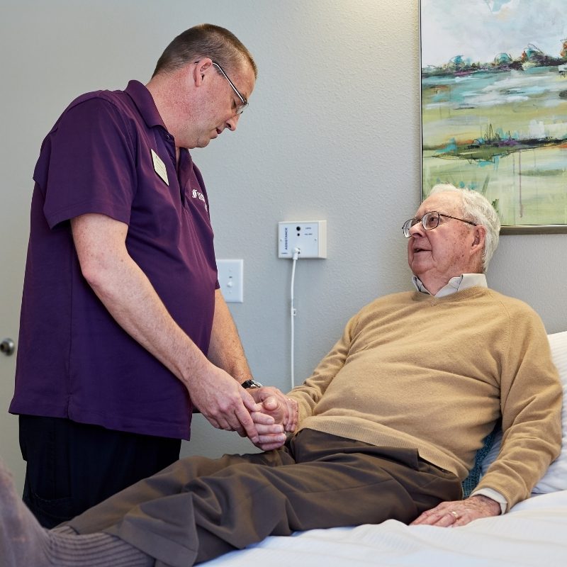 Someren Glen Senior Living Community in Centennial, CO - clinical team member checking in on resident square