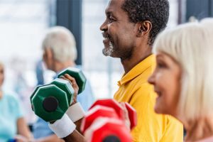 Someren Glen Senior Living Community in Centennial, CO - seniors in gym with weights