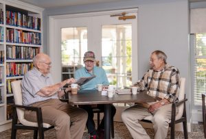 Someren Glen Senior Living Community in Centennial, CO - three men sitting at a table having coffee