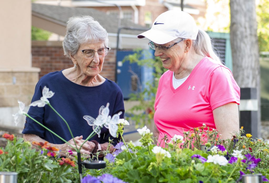 Someren Glen Senior Living Community in Centennial, CO - two women tending to a garden