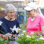 Someren Glen Senior Living Community in Centennial, CO - two women tending to a garden