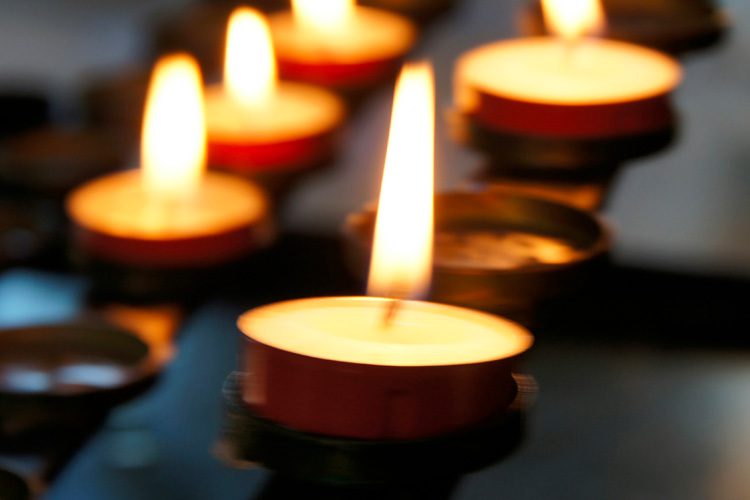 lit votive candles Someren Glen Senior Living Community in Centennial, CO - lit votive candles