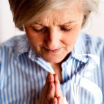 Someren Glen Senior Living Community in Centennial, CO - senior woman praying