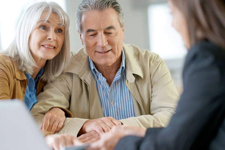 Someren Glen Senior Living Community in Centennial, CO - senior adult couple meeting with a professional
