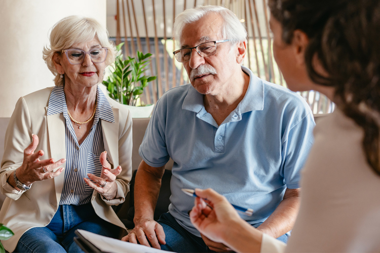someren glen senior couple meeting with professional person Someren Glen Senior Living Community in Centennial, CO - someren glen senior couple meeting with professional person