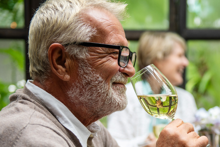 someren glen senior man enjoys frangrance of wine Someren Glen Senior Living Community in Centennial, CO - someren glen senior man enjoys frangrance of wine