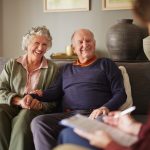 Someren Glen Senior Living Community in Centennial, CO - someren glen senior couple sitting with professional