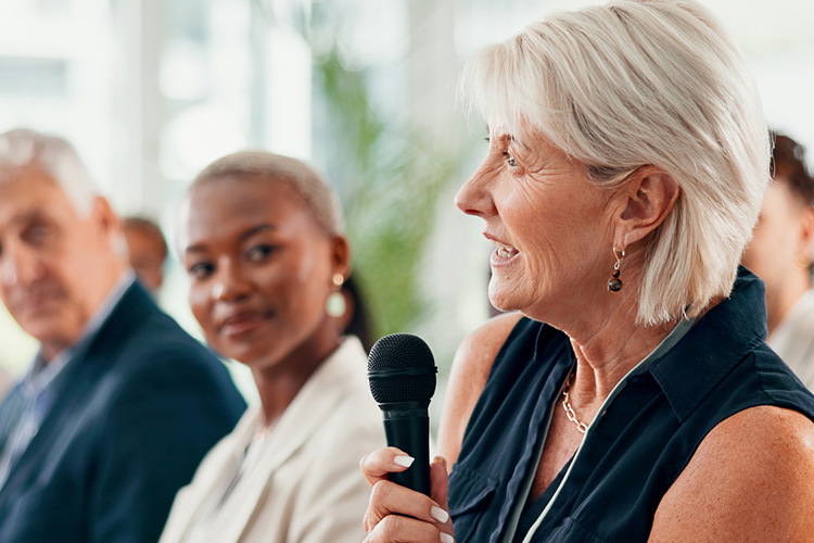 someren glen senior woman speaking in group Someren Glen Senior Living Community in Centennial, CO - someren glen senior woman speaking in group